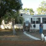 The front of their home. It has three bedrooms, and a functional kitchen, a comfortable living room, and two baths. Nice!