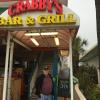 Speaking of Spike, here he is 
standing in front of the entrance way to Crabby's 
Bar & Grill after we left Hooters. It is just acros the street from the Gulf.