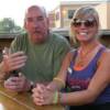 I don't know how he does it, but here is MR. WARMTH sitting beside one of the lovely waitresses out on the Patio, KRISTIN. 