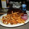 The "Special" at Legends 
on Wednesday nights 
during the summer is 
1/2 slab of ribs with Fries 
for $6.99. Here is a
pic of what you get. 