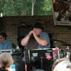 The harmonica player/singer in the center of this pic is none other than the Great COLIN DUSSAULT, Leader of Colin Dussault's Blues Project playing out on The Galaxy Patio. 