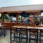 The next four pics were taken of the patio bar, tables, and chairs. It was early in the evening so it wasn't that crowded at the time. And we 
believe that the recent weather had a lot to do with the turnout.