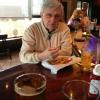 The CANDYMAN chowing down on the Happy Hour Fries
at the bar.