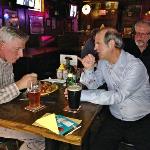 The Forester, R. B., and S. B. 
sitting at a table next to the bar. 