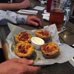 R. B. decided to try another 
appetizer, the Stuffed Potato
Skins. They gave him a generous portion so he offered me one. I tried one.
A little dry, but tasty.