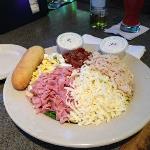 SPIKE (Swish) was eating 
healthy. This was his Chef's
Salad until he mixed it altogether.
Yes, there was lettuce under
all of that.