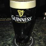 This is a Guinness draft beer. 
It is a thick malt stout, and
very hard to pour from the 
tap. It takes longer for a
bartender to pour it than the other beers on tap.
Our bartender, SARAH, made
what you call the "Perfect Pour"! 