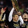 Urban Meyer hoisting the 
NCAA Championship Trophy
won by the Ohio State Buckeyes.