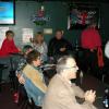 Another pic in the back of some Christmas revelers. the staff at JOM (the bar) had to bring osme tables and chairs from the loft upstairs to accomodate the number of peopel there. 