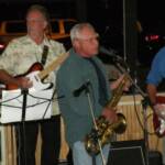 Another shot of the band with Donnie belting out a tune, and HANK, and JACK doin' some pickin'.