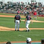 HERE IS JOEL SKINNER, THIRD BASE COACH, ASKING HAFNER: "HOW THE HECK DID YOU GET ON BASE?"