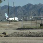 YOU CAN SEE AIRPLANES BEYOND THE CENTERFIELD FENCES. THIS IS NOT AN ACTIVE AIRPORT. THESE PLANES ARE STRIPPED DOWN, AND SOLD TO THIRD WORLD COUNTIRES.