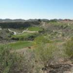 THIS IS A GOLF COURSE BELIEVE IT OR NOT IN TUCSON. IT USED TO BE A HOLE INT EH GROUDN, AND SOMEONE BUILT A COURSE NEARBY,A ND DECIDED TO PUT TWO OR THREE HOLES DOWN IN IT! NO THANKS.  